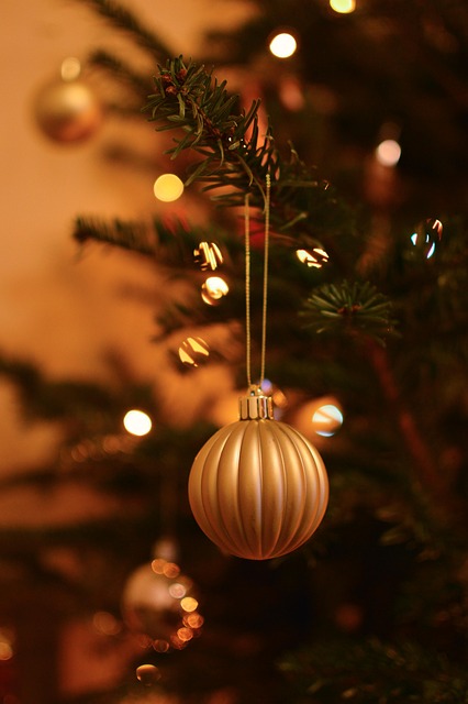 painting and decorating wooden ornaments with warm beige and sage tones