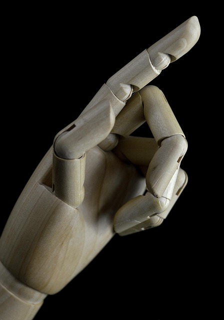 hands crafting wooden toys sanding and finishing in warm woodworking studio